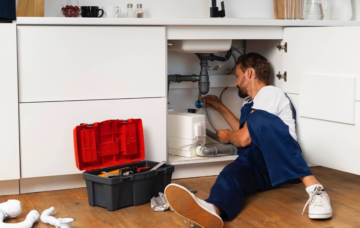 Licensed plumber completing plumbing repairs